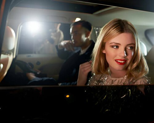 lady enjoying city tour in luxury limousine