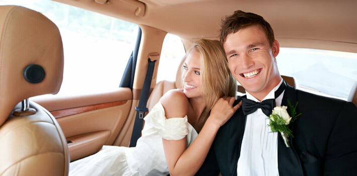 wedding couple enjoy the transportation service with AA Lux Ride